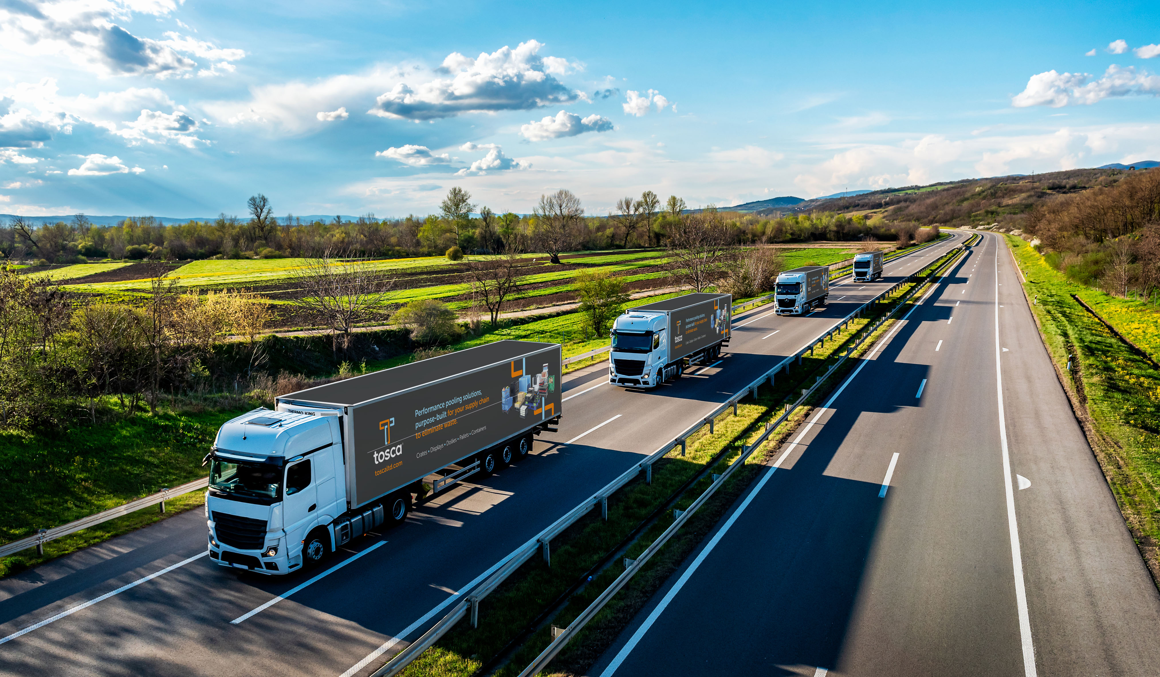 a fleet of trucks on a divided highway - Tosca Branding _1_.jpg